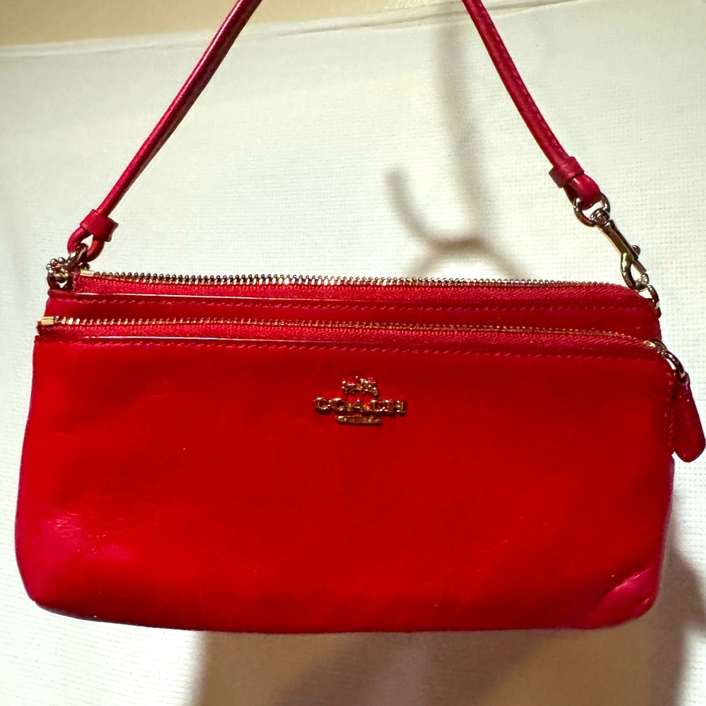 Coach Wristlet 8 x 4.75. Refined pebble leather/Fabric lining. 8 cc slots.